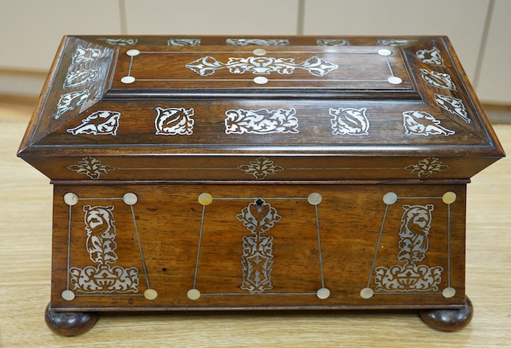 A Victorian rosewood and mother-of-pearl inlaid sarcophagus tea caddy, 39cm wide. Condition - fair